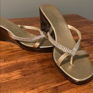 Gold dressy flip flops.